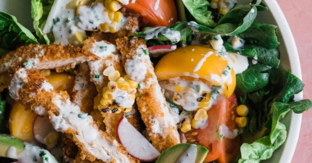 Fresh ingredients of the Sweetgreen Harvest Bowl, including kale, chicken, and quinoa.