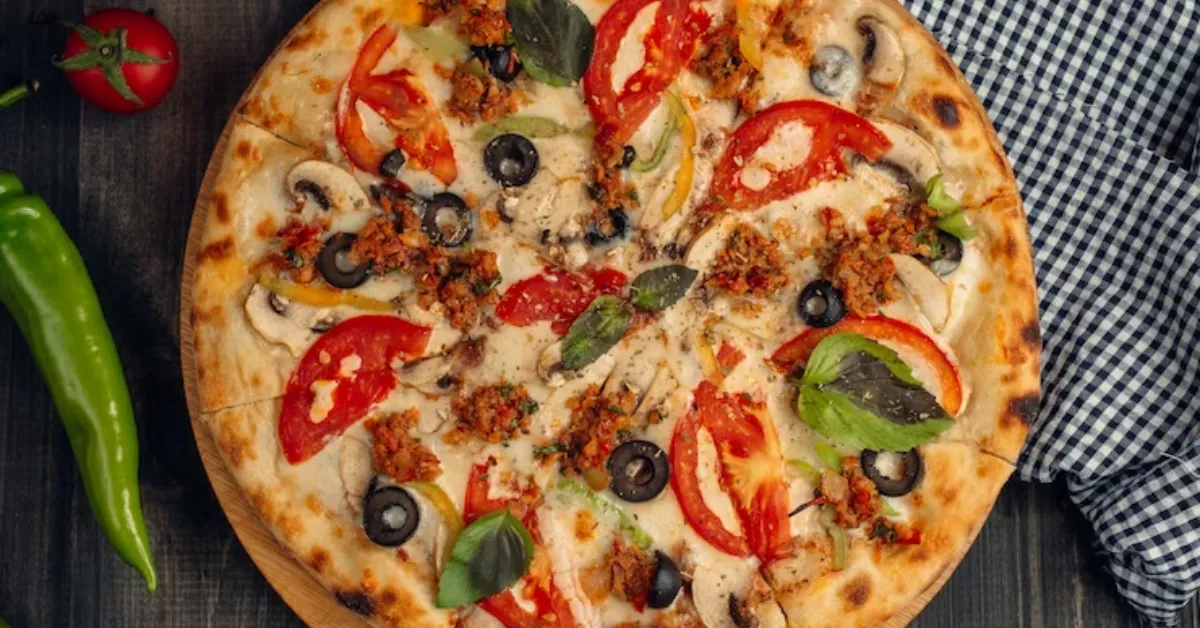 pizza with tomato slices, mushroom, olive