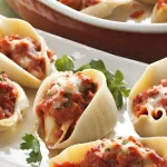 Close-up of a plate of San Giorgio stuffed shells with meat and cheese